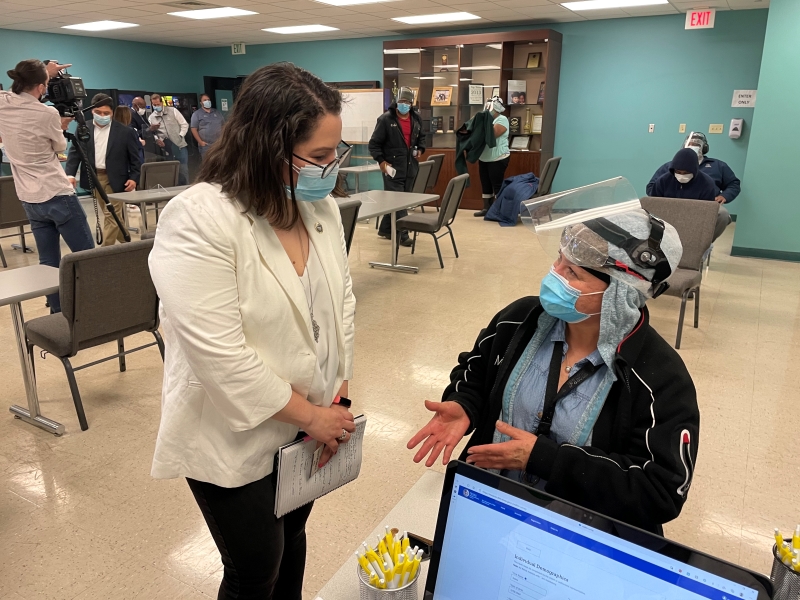 LULAC CEO Sindy Benavides speaks with a Tyson Foods employee during the company’s vaccination event at its Houston, Texas, prepared foods plant on May 14, 2021.