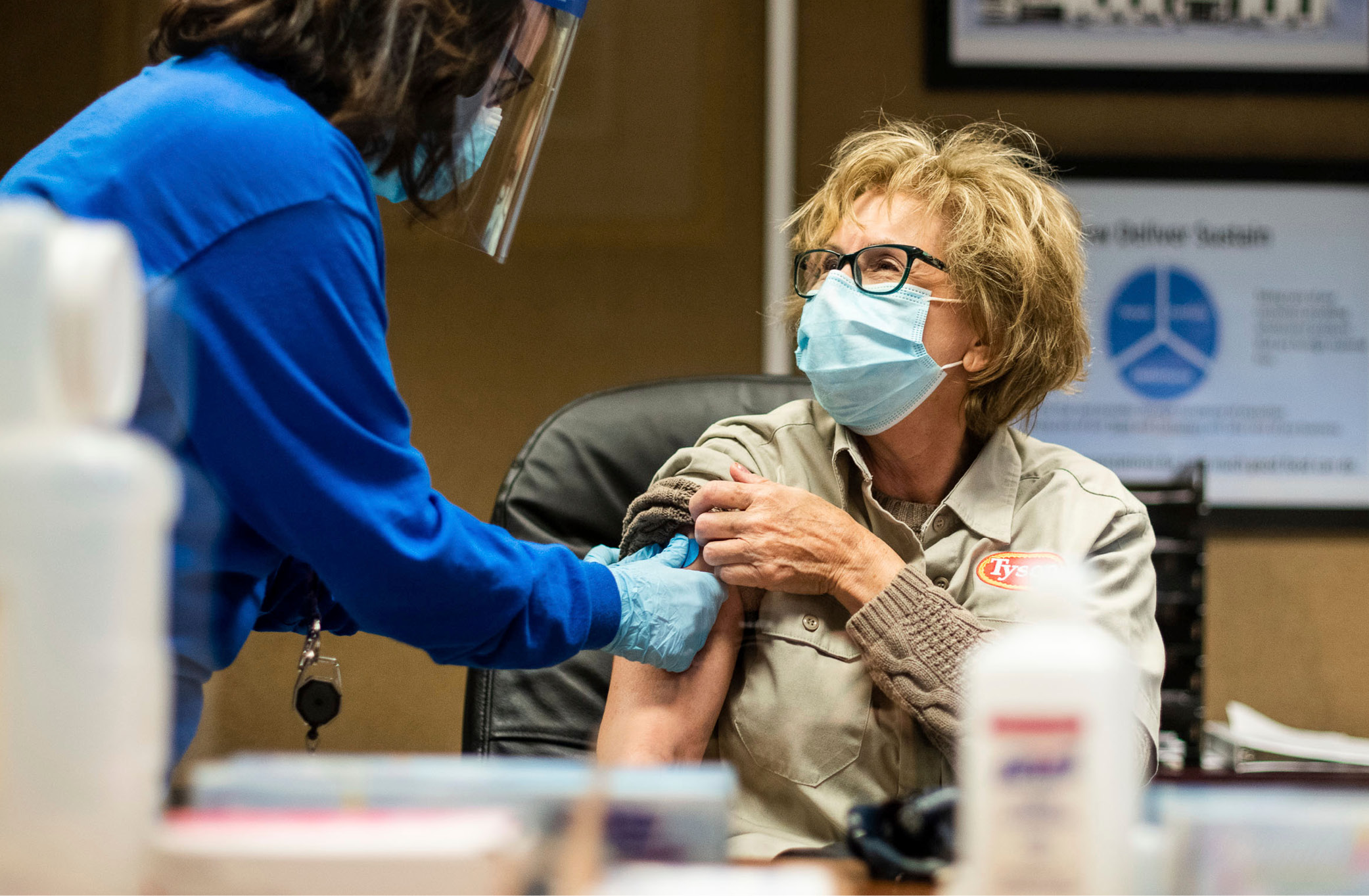 A photo of a team member getting vaccinated.