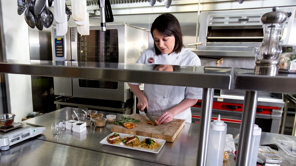 This is a photo of a chef working in a kitchen.