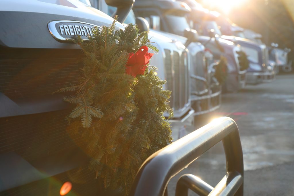 This is a photo of a wreath on a vehicle.