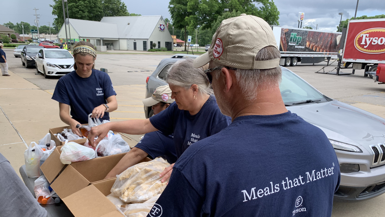 A photo of team members going through a donation box.