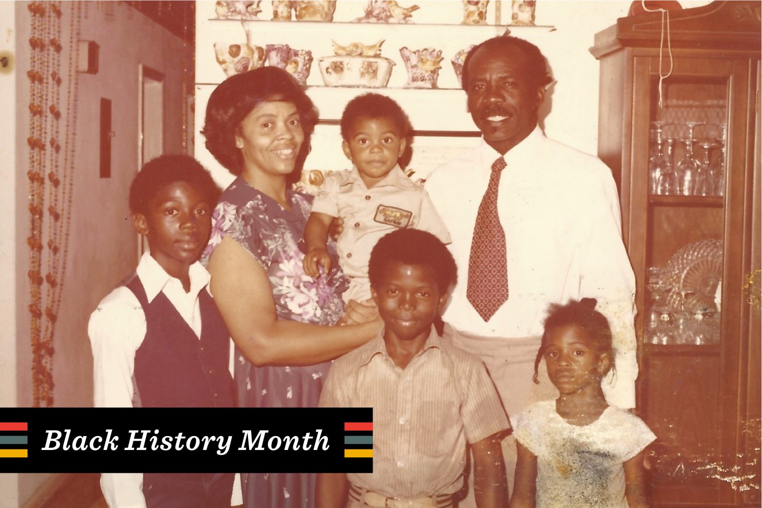 Love and the Power of Black History This is a photo of a family smiling together.