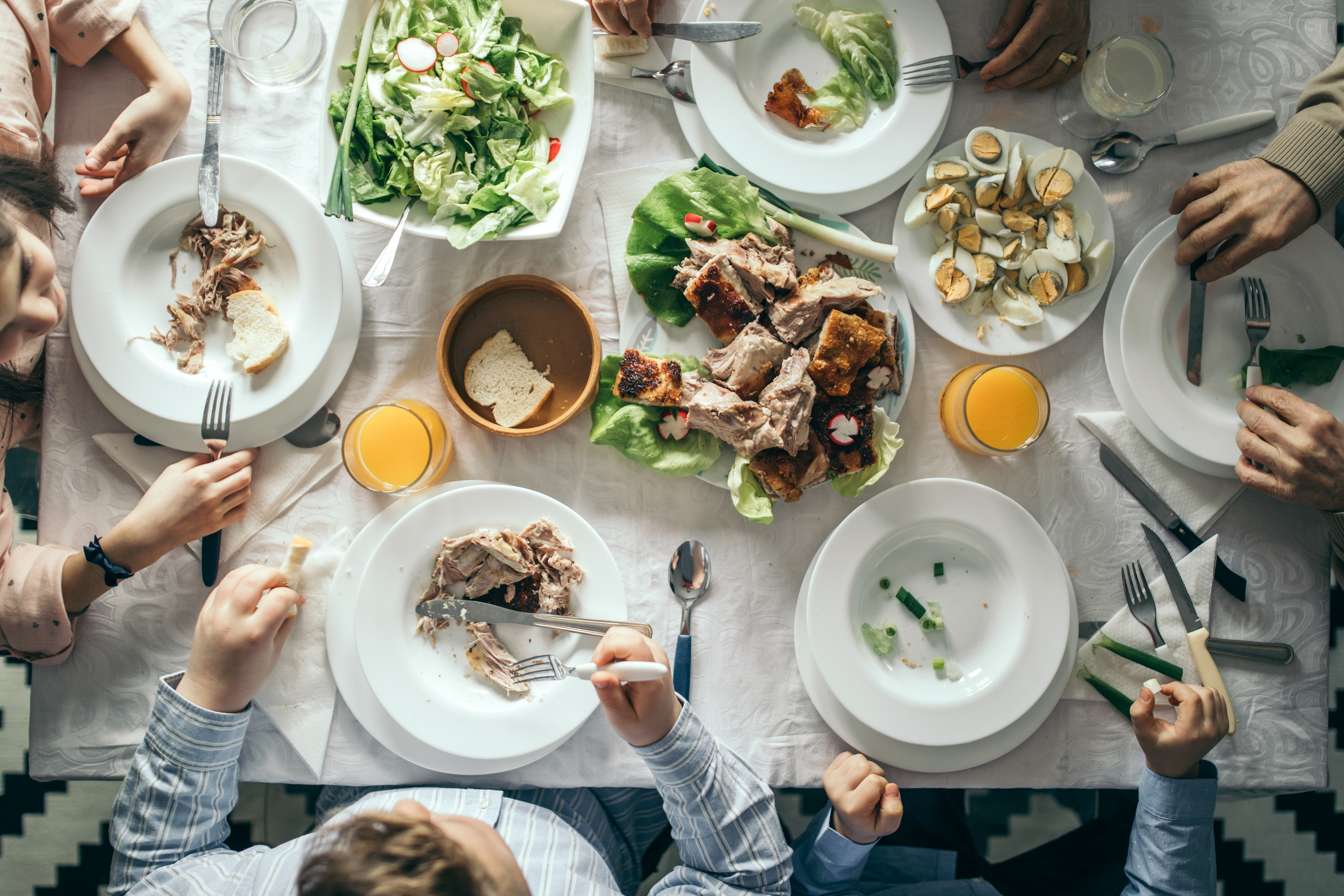 People eating a large meal together