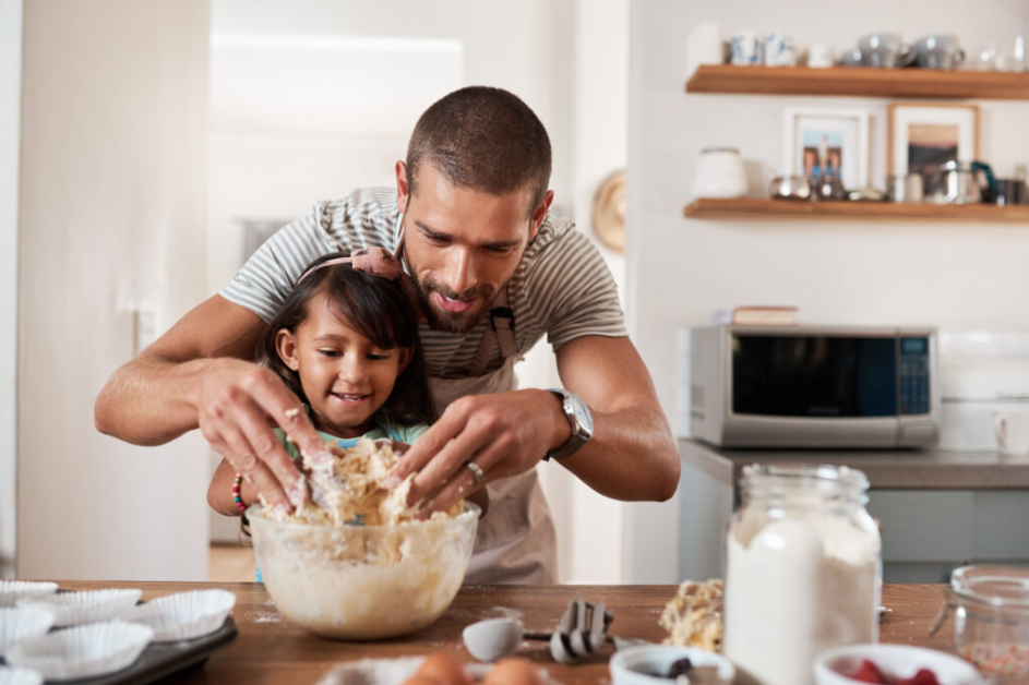 A father and daughter cooking