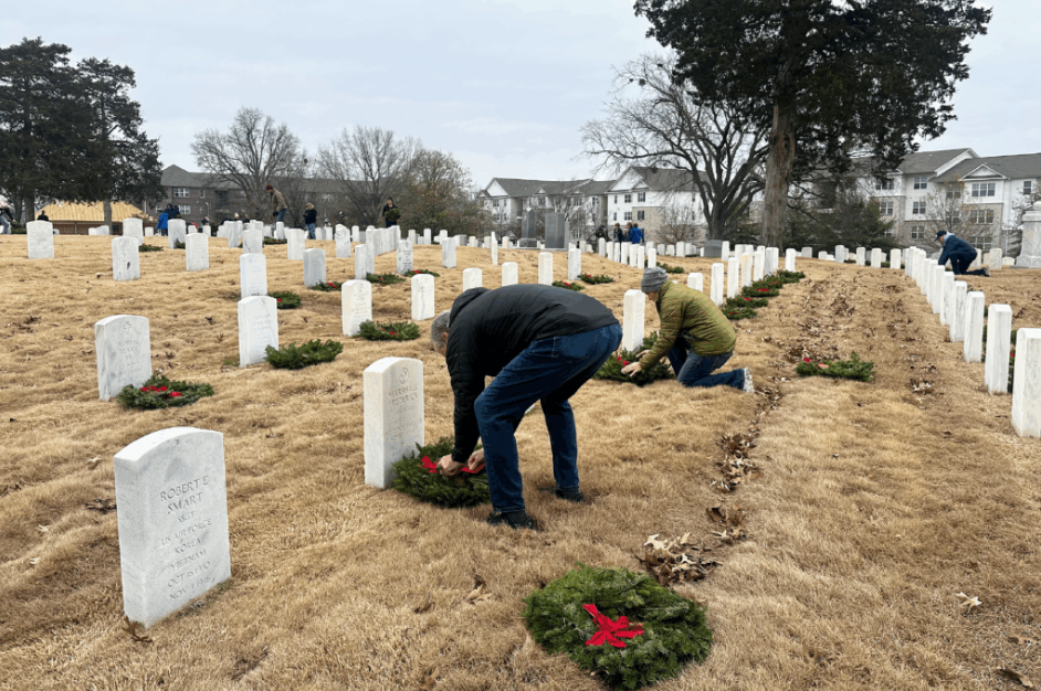 Team members placing wreaths for National Wreaths Across America Day
