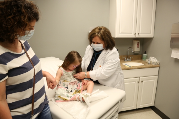 This is an image of a nurse caring for a child.