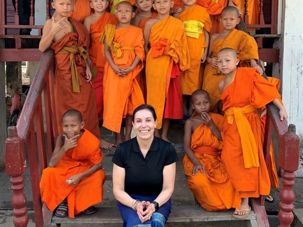 Carol Kijac, author of The Wayward Explorer, teaching English to monks in Laos.